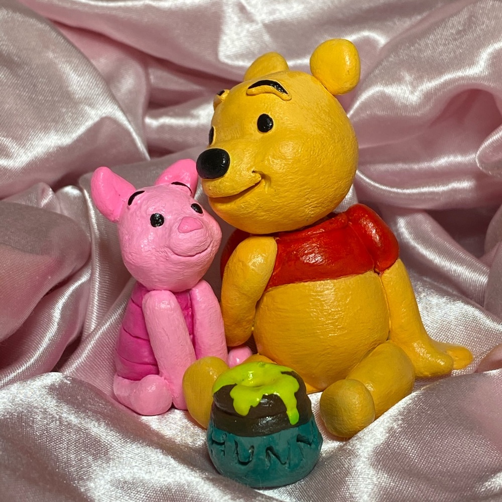 Winnie the Pooh, Piglet, and Hunny pot